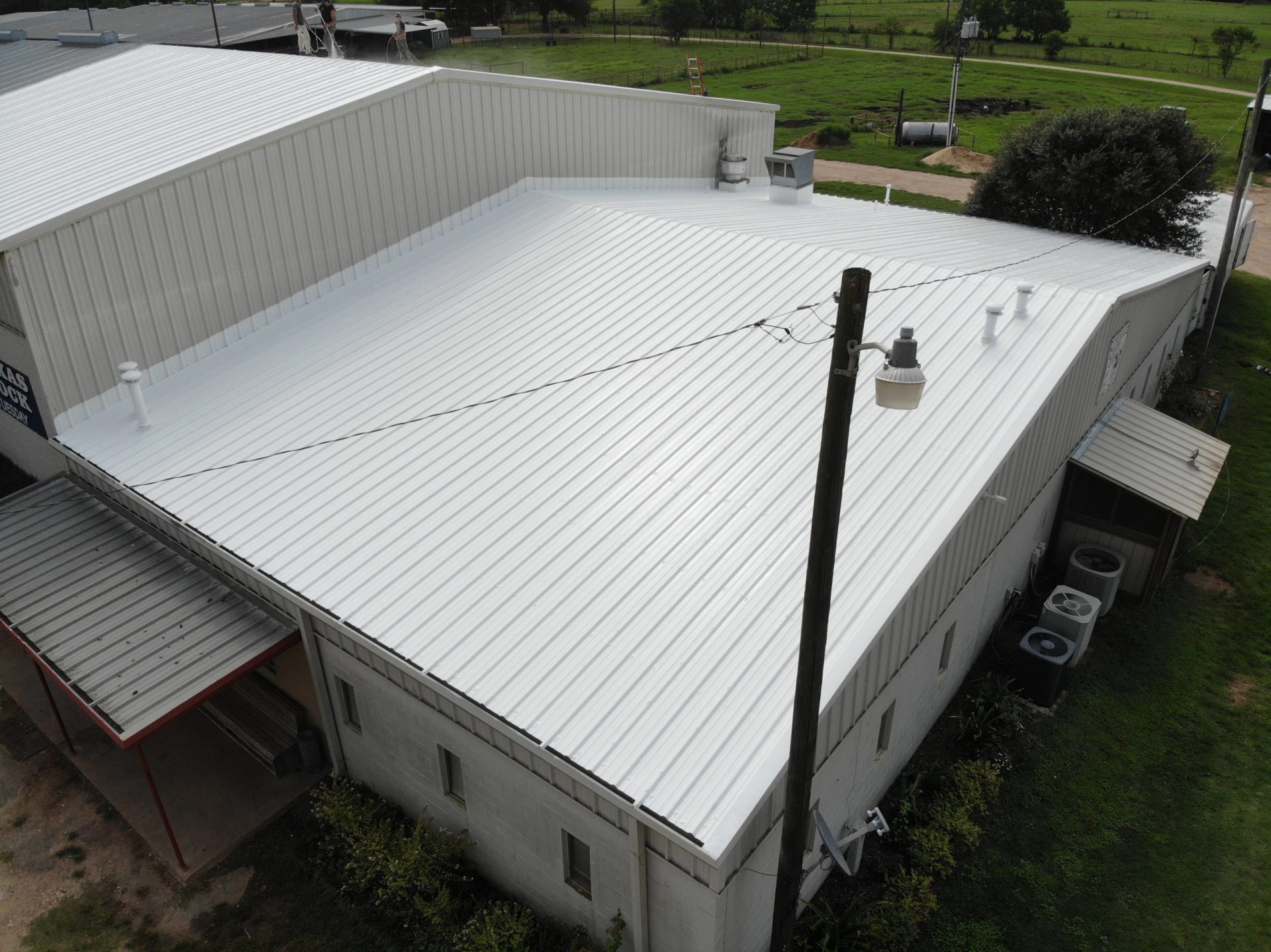 white coating metal restoration Alliance Roofing & Construction